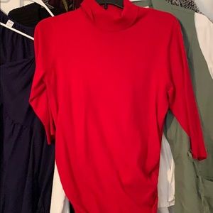 Red turtleneck sweater. 3/4 sleeves and ruching